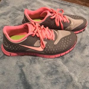 Gray and bright pink Nike Free Run